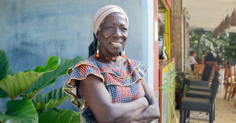Cheryl Johnson in front of the Fig Tree restaurant on Bequia.