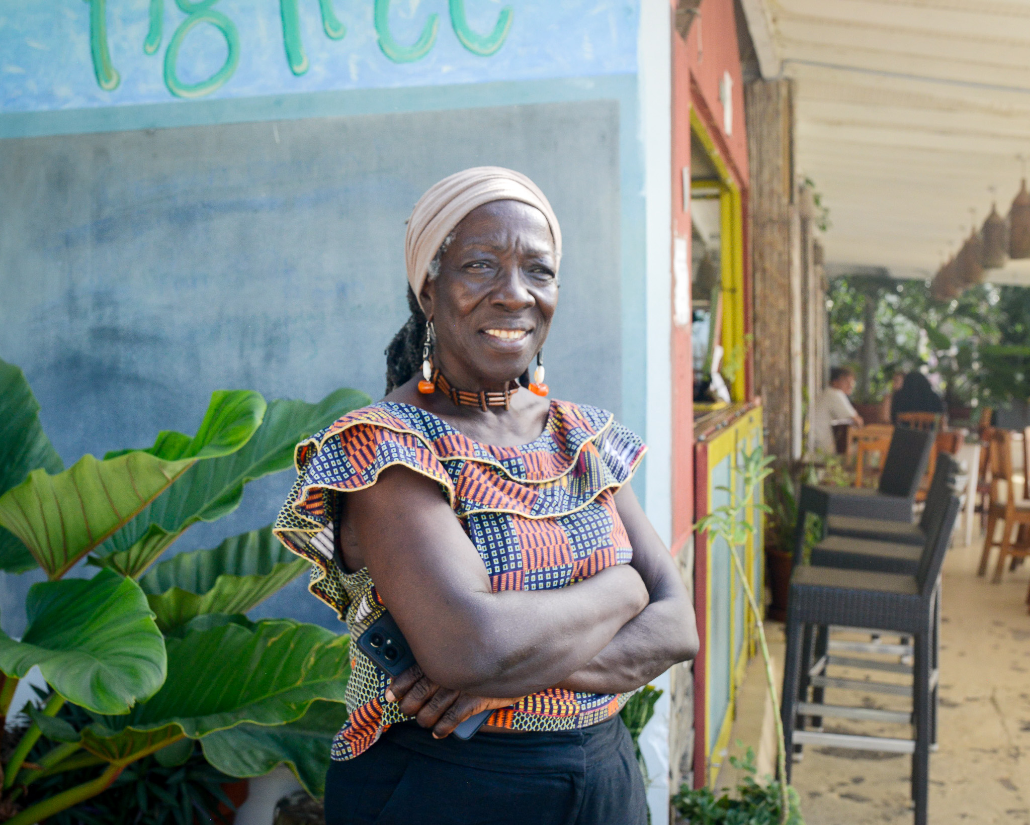 Cheryl Johnson in front of the Fig Tree restaurant on Bequia.