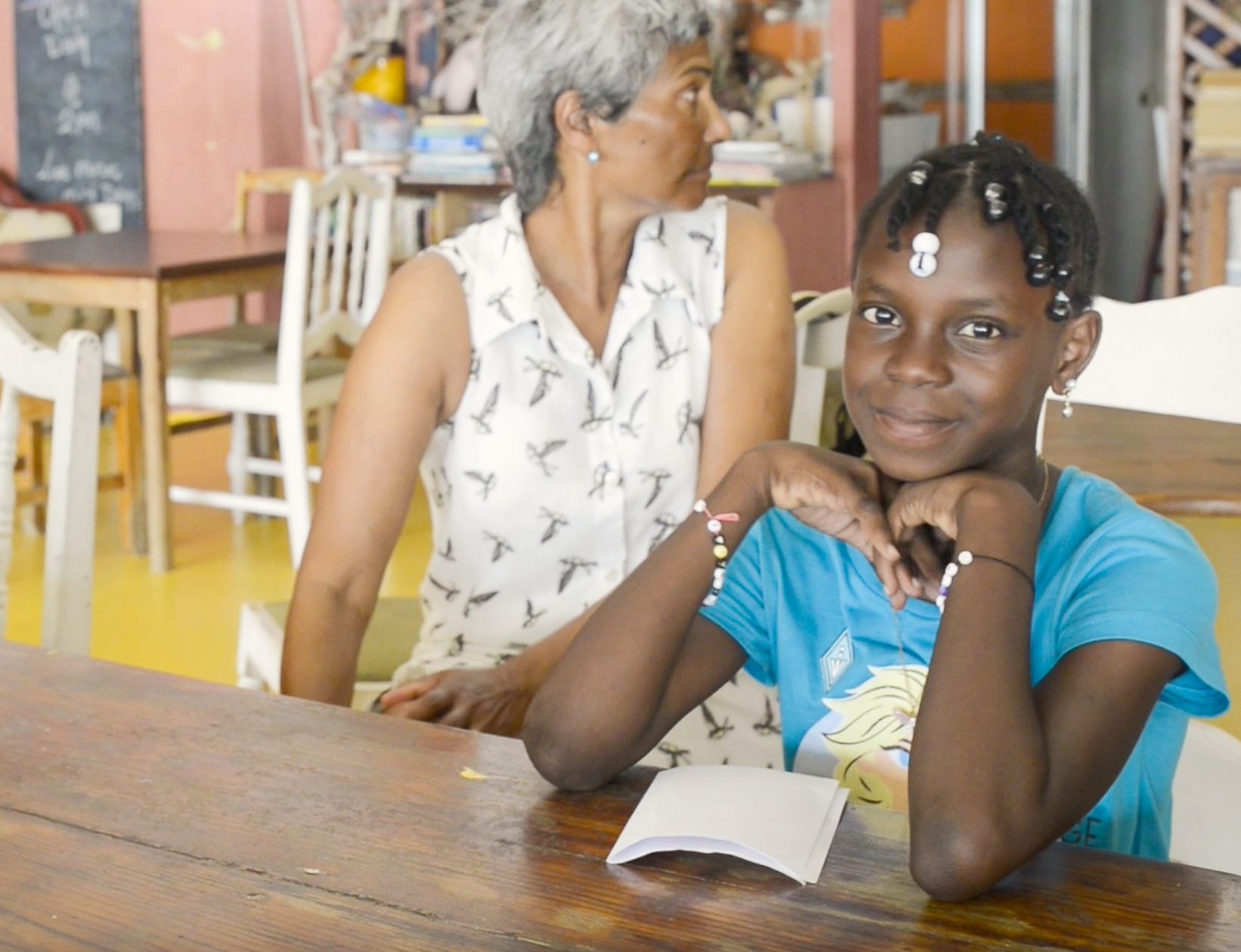 A child waiting for her turn to give her book report.